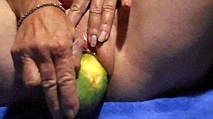 close-up wet pussy gaping wide from thick cucumber masturbation plunge