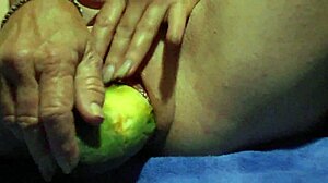 close-up wet pussy gaping wide from thick cucumber masturbation plunge