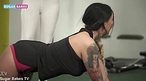 athletic greek brunette adel asanty licks tattooed fitness babe's wet pussy in gym