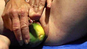 close-up wet pussy gaping wide from thick cucumber masturbation plunge