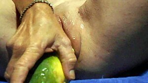 close-up wet pussy gaping wide from thick cucumber masturbation plunge