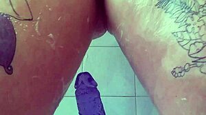 oh god im rubbing my soaked pussy with this huge purple dildo in the bath till i explode