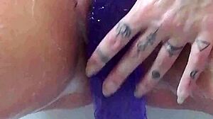 oh god im rubbing my soaked pussy with this huge purple dildo in the bath till i explode
