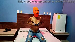 brunette stepsis masks up in hotel bed shaking hips naked for halloween fun
