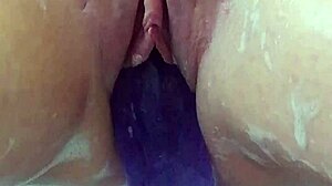 oh god im rubbing my soaked pussy with this huge purple dildo in the bath till i explode
