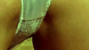Bound lesbian slave oils up and massages her mistress's big tits and pussy submissively