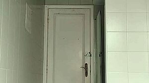 suggestive sexy guy shaves smooth in black beach shorts