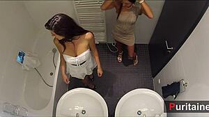 two cam girls get soft and voyeur in bathroom