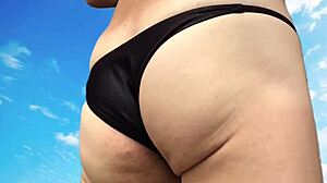sexy bikini beach handjob jerks throbbing cock hard