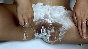 shaving her smooth pussy closeup with trimmer and razor