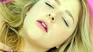 young blonde casually shows off her sexy petite body on the sofa