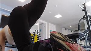 chatty blonde teases and flashes her curves during gym workout