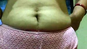 Indian beauty undresses teasing boobs building hot foreplay tension