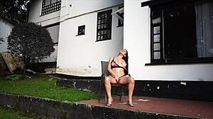 Mature latina fingers herself hard in hotel garden lingerie