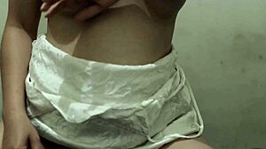 oiled big ass asian in miniskirt masturbates pussy