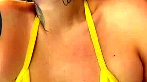 Tanned gym girl in see-through bikini flashes wet pussy publicly
