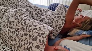 Cozy couple shares tender early morning intimacy in bedroom