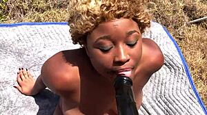 Porsha Carrera rips clothes and straps big dildo deep into submissive ebony Nina Rivera on beach