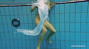 Kristy shakes massive boobs wildly. Hot babe dives deep underwater in steamy pool action