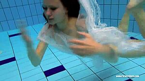Kristy shakes massive boobs wildly. Hot babe dives deep underwater in steamy pool action
