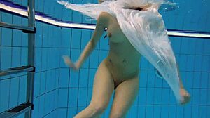 Kristy shakes massive boobs wildly. Hot babe dives deep underwater in steamy pool action