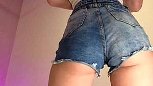 those tiny denim shorts barely cover her juicy ass cheeks