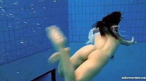 Kristy shakes massive boobs wildly. Hot babe dives deep underwater in steamy pool action