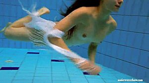Kristy shakes massive boobs wildly. Hot babe dives deep underwater in steamy pool action