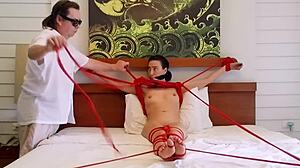 sofi tied tight in red ropes on bed part two
