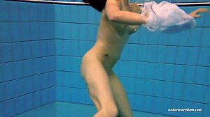 Kristy shakes massive boobs wildly. Hot babe dives deep underwater in steamy pool action
