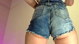 those tiny denim shorts barely cover her juicy ass cheeks