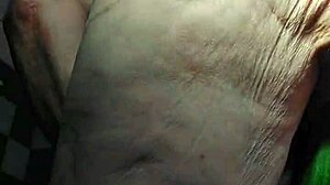 oma fucks her hairy pussy with huge cucumber