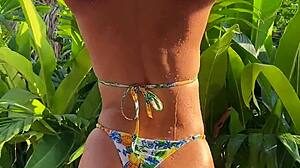 tanned bikini beauty grinds hard in tropical garden sun