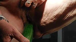 oma fucks her hairy pussy with huge cucumber