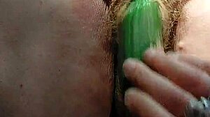 oma fucks her hairy pussy with huge cucumber