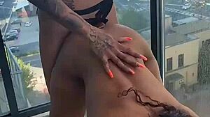 renity love straps kashofficials on the balcony outside