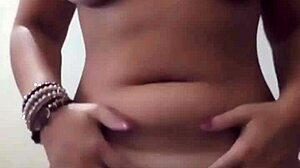 piercing her wet pussy lips for intense pleasure
