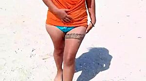 doesn't this horny mexican puta flashing her thong and tits on public beach turn you on?