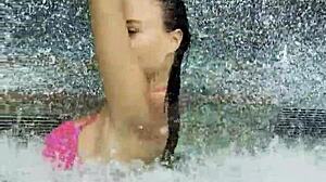 Monika Fox's huge fake tits spill from pink bikini at poolside strut