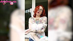 Redhead babe washes windows wearing wet t-shirt at home
