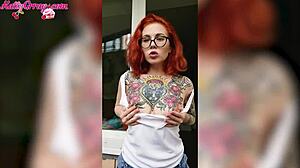 Redhead babe washes windows wearing wet t-shirt at home