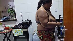chubby stepmom's big tits shake wildly during kitchen pounding