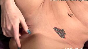 elle strips off her corset and masturbates right away