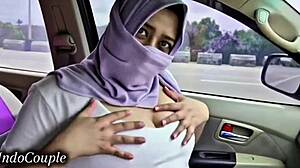 hijab wife plays with cock in car