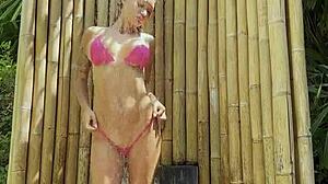 hot monika fox poses in pink bikini outdoors