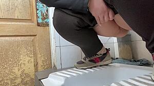 Mature milf pees in a hospital public toilet