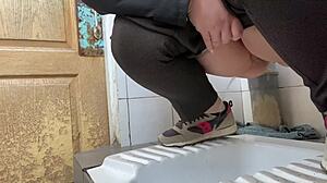 Mature milf pees in a hospital public toilet