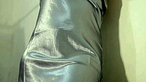 sexy girl wearing satin dress masturbating and getting wet
