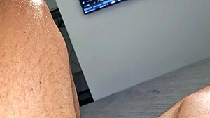 Man in towel strokes hard with close up finish