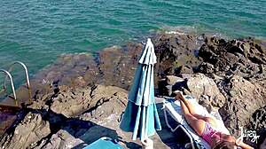 Masturbating on the rocks with juicy pussy lips